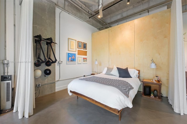 bedroom with concrete floors