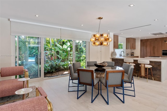 1075 NE 99th St, Miami Shores, FL 33138 - dining space with healthy amount of natural light, a chandelier, and recessed lighting