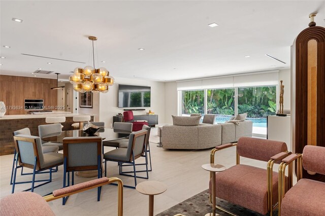 1075 NE 99th St, Miami Shores, FL 33138 - dining room with a chandelier, recessed lighting, and light wood-style flooring