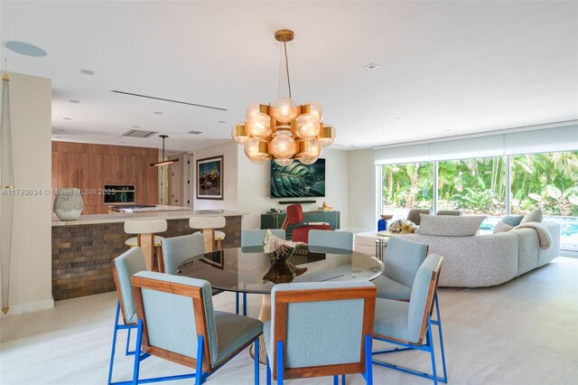 1075 NE 99th St, Miami Shores, FL 33138 - dining room featuring a chandelier