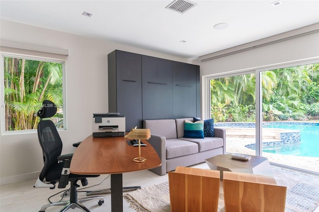 home office featuring baseboards and visible vents
