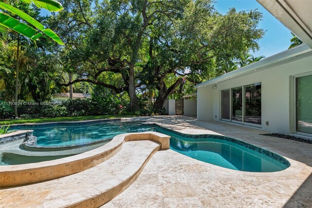 1075 NE 99th St, Miami Shores, FL 33138 - view of pool with a patio area and a fenced backyard