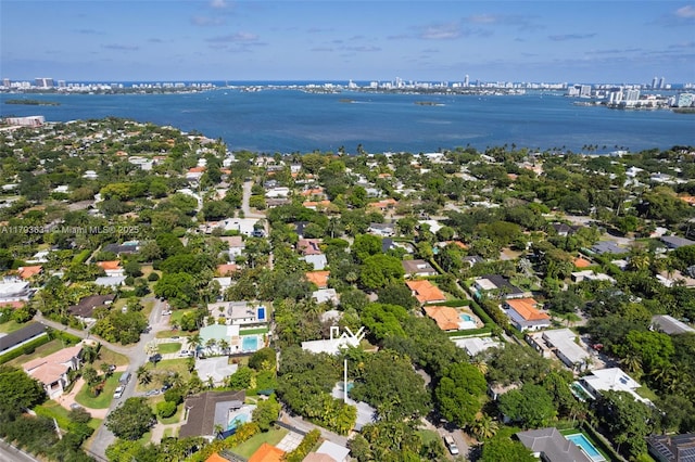 bird's eye view with a water view, a residential view, and a city view