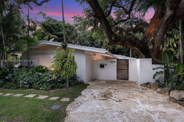 1075 NE 99th St, Miami Shores, FL 33138 - view of front facade featuring stucco siding