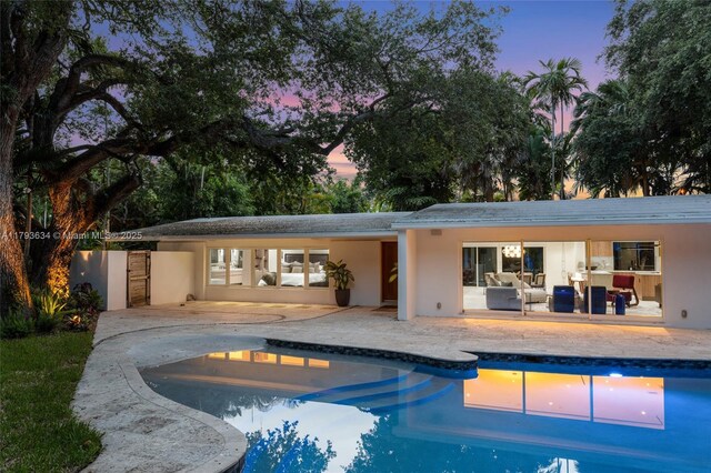 1075 NE 99th St, Miami Shores, FL 33138 - swimming pool featuring a patio area and an outdoor hangout area