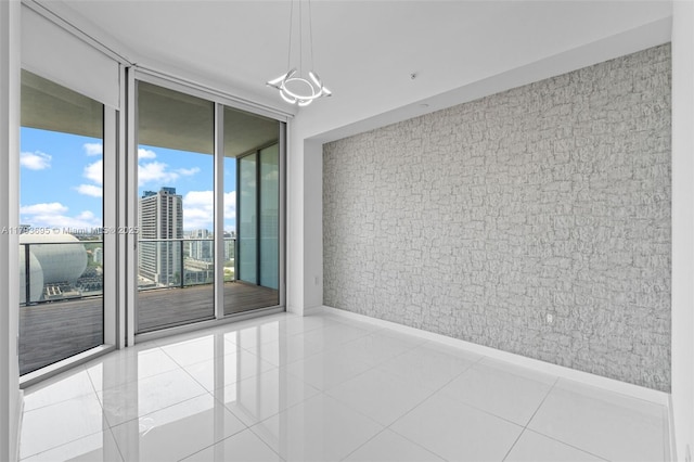 851 NE 1st Ave Unit 1506, Miami, FL 33132 - tiled spare room with a view of city, floor to ceiling windows, and baseboards