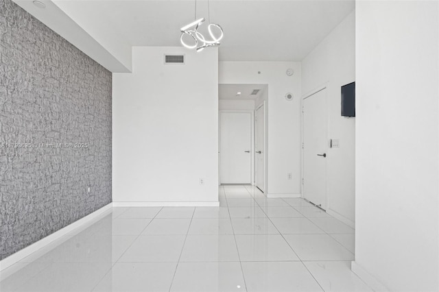 851 NE 1st Ave Unit 1506, Miami, FL 33132 - unfurnished room with baseboards, visible vents, light tile patterned floors, and an inviting chandelier