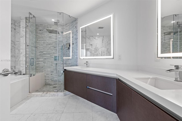 851 NE 1st Ave Unit 1506, Miami, FL 33132 - bathroom featuring a sink, a shower stall, double vanity, and marble finish floor