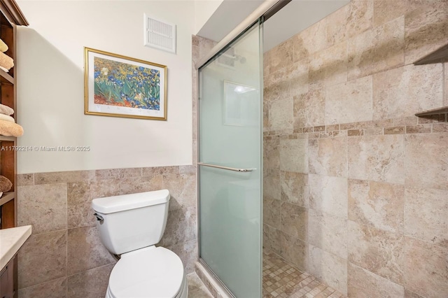 10761 SW 113th Pl Unit 102D, Miami, FL 33176 - full bath with vanity, visible vents, toilet, tile walls, and a stall shower