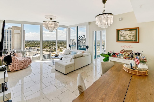 333 Las Olas Way Unit 2401, Fort Lauderdale, FL 33301 - living area featuring a notable chandelier and floor to ceiling windows