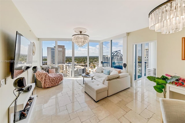 333 Las Olas Way Unit 2401, Fort Lauderdale, FL 33301 - sunroom / solarium featuring a healthy amount of sunlight, a city view, and a chandelier