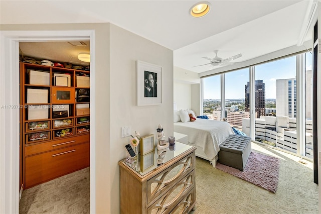 333 Las Olas Way Unit 2401, Fort Lauderdale, FL 33301 - bedroom with a view of city, ceiling fan, and light carpet