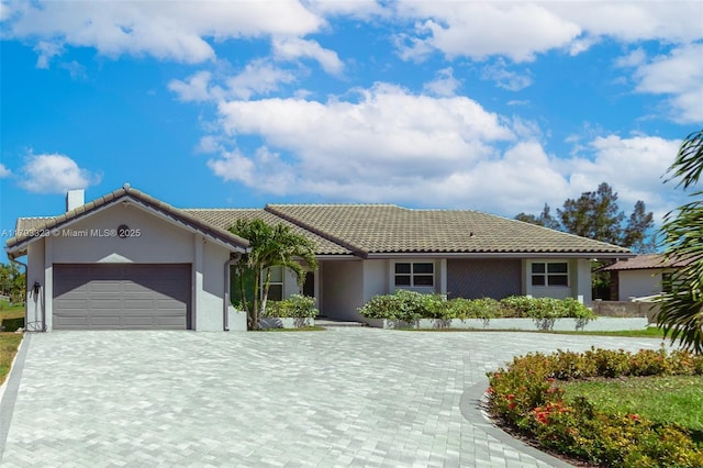3401 SW 141st Ave, Miramar, FL 33027 - single story home with a garage, decorative driveway, stucco siding, a tiled roof, and a chimney