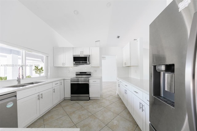 3401 SW 141st Ave, Miramar, FL 33027 - kitchen with stainless steel appliances, a sink, backsplash, white cabinets, and light countertops