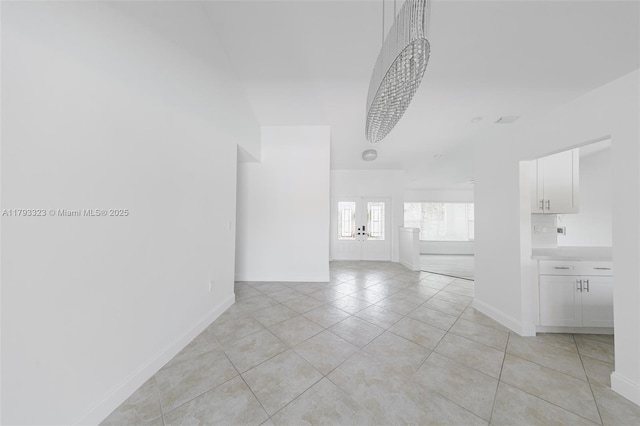 3401 SW 141st Ave, Miramar, FL 33027 - empty room featuring baseboards, light tile patterned floors, and french doors