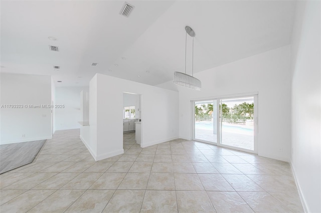 3401 SW 141st Ave, Miramar, FL 33027 - unfurnished room with light tile patterned floors, healthy amount of natural light, baseboards, and a high ceiling
