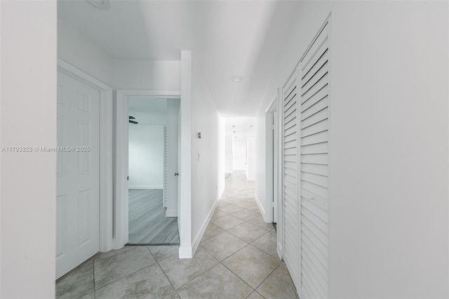 3401 SW 141st Ave, Miramar, FL 33027 - corridor featuring light tile patterned flooring, built in features, and baseboards