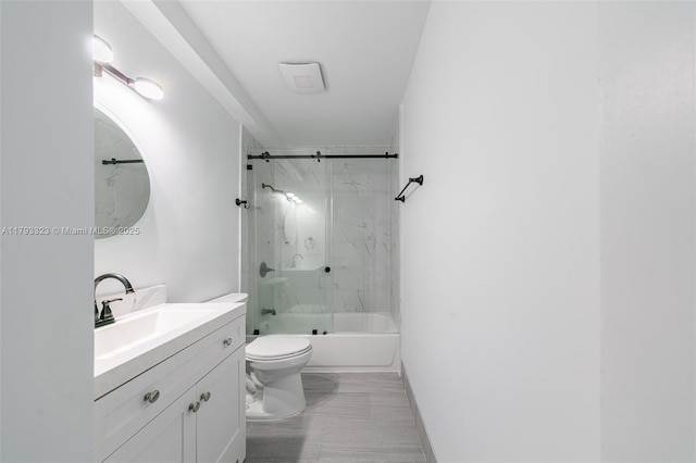 3401 SW 141st Ave, Miramar, FL 33027 - bathroom with toilet, vanity, shower / bath combination with glass door, and marble finish flooring