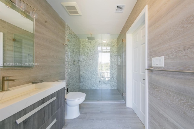 3401 SW 141st Ave, Miramar, FL 33027 - bathroom with toilet, a stall shower, vanity, and wooden walls