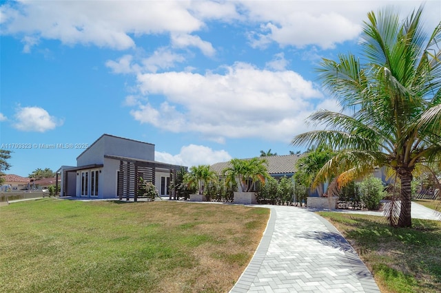 3401 SW 141st Ave, Miramar, FL 33027 - view of property's community featuring a yard and decorative driveway