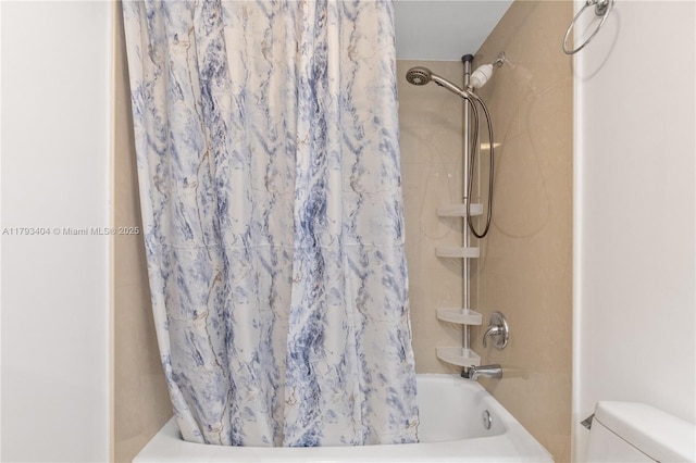 full bath with shower / bath combo and toilet