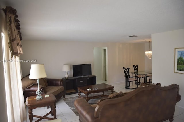 4701 NW 43rd Ave, Tamarac, FL 33319 - living area with visible vents, light tile patterned floors, and a notable chandelier