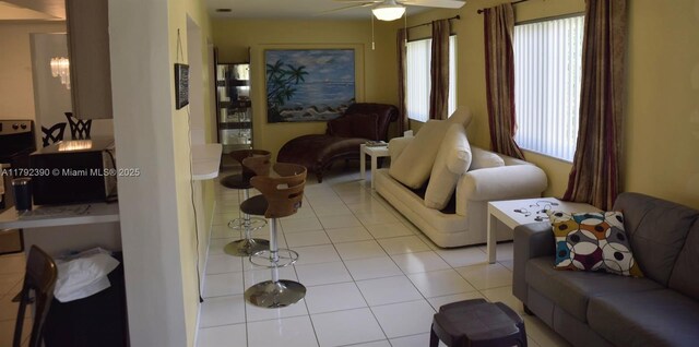 4701 NW 43rd Ave, Tamarac, FL 33319 - living room with a ceiling fan and light tile patterned floors