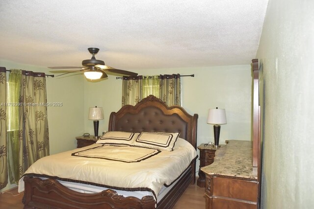 4701 NW 43rd Ave, Tamarac, FL 33319 - bedroom with ceiling fan, dark wood finished floors, and a textured ceiling