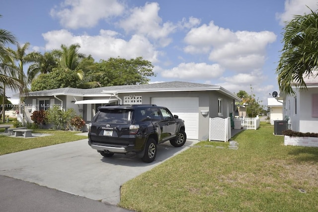 4701 NW 43rd Ave, Tamarac, FL 33319 - single story home featuring a garage, a front yard, stucco siding, central air condition unit, and driveway