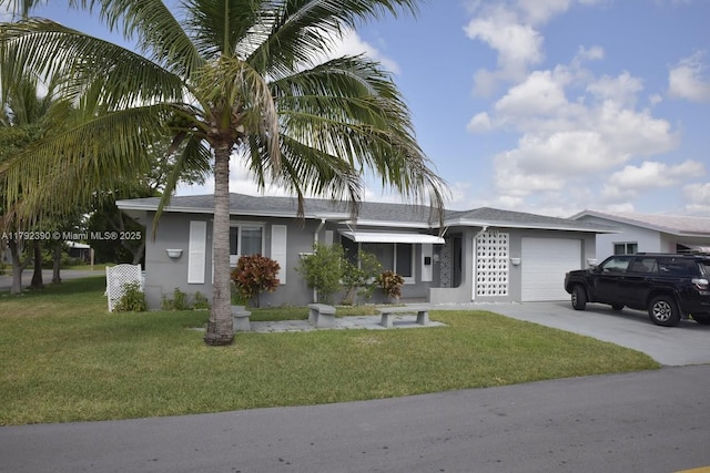 4701 NW 43rd Ave, Tamarac, FL 33319 - ranch-style house featuring a garage, stucco siding, driveway, and a front yard