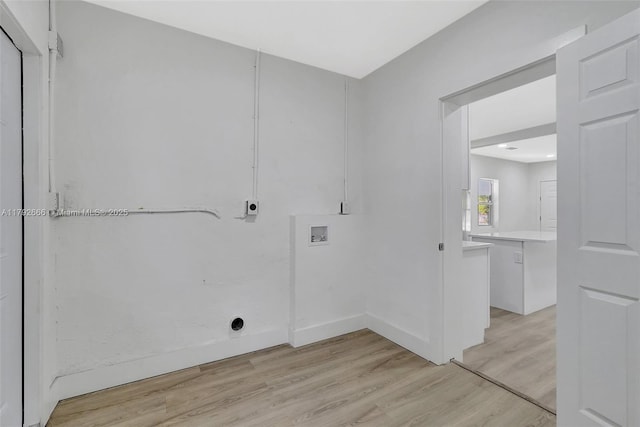 washroom with laundry area, baseboards, washer hookup, light wood finished floors, and hookup for an electric dryer
