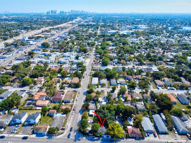 birds eye view of property with a view of city