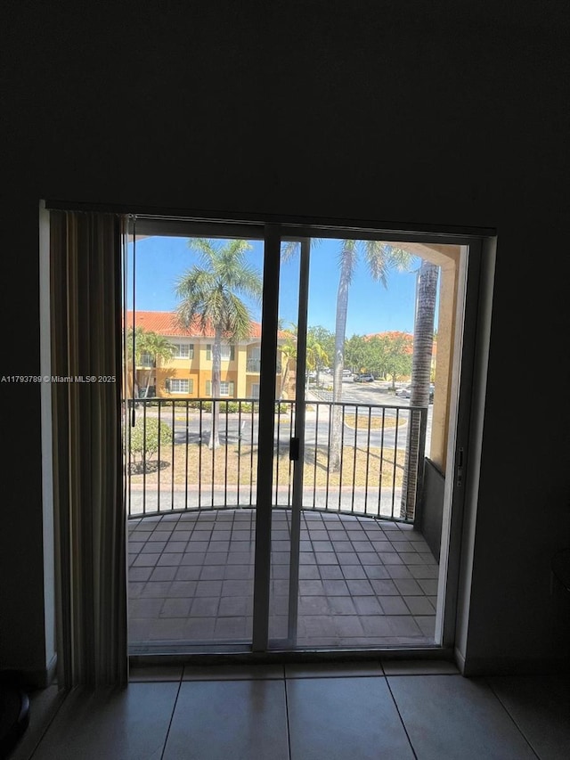 7270 NW 114th Ave Unit 203-9, Doral, FL 33178 - entryway with a healthy amount of sunlight and tile patterned flooring