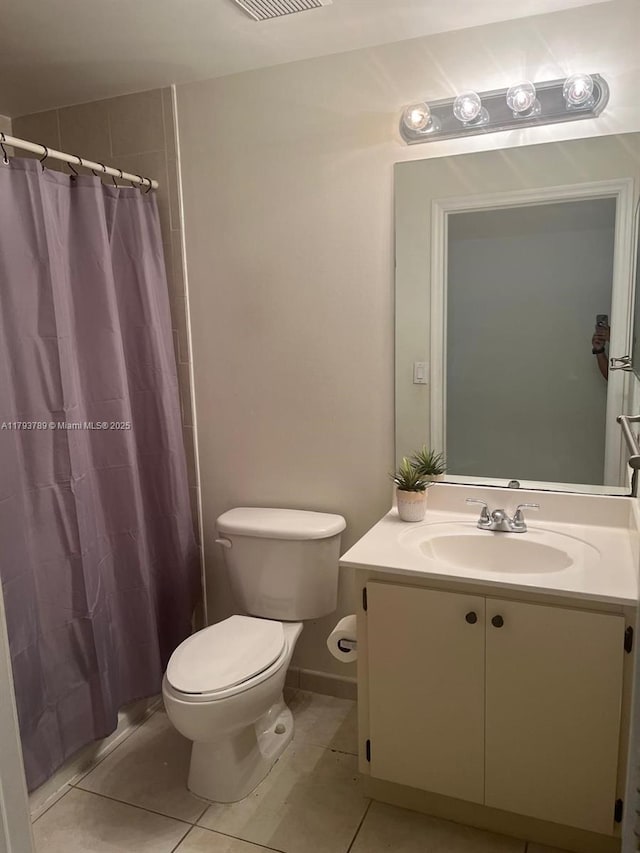 full bath featuring vanity, visible vents, toilet, a shower with shower curtain, and tile patterned floors