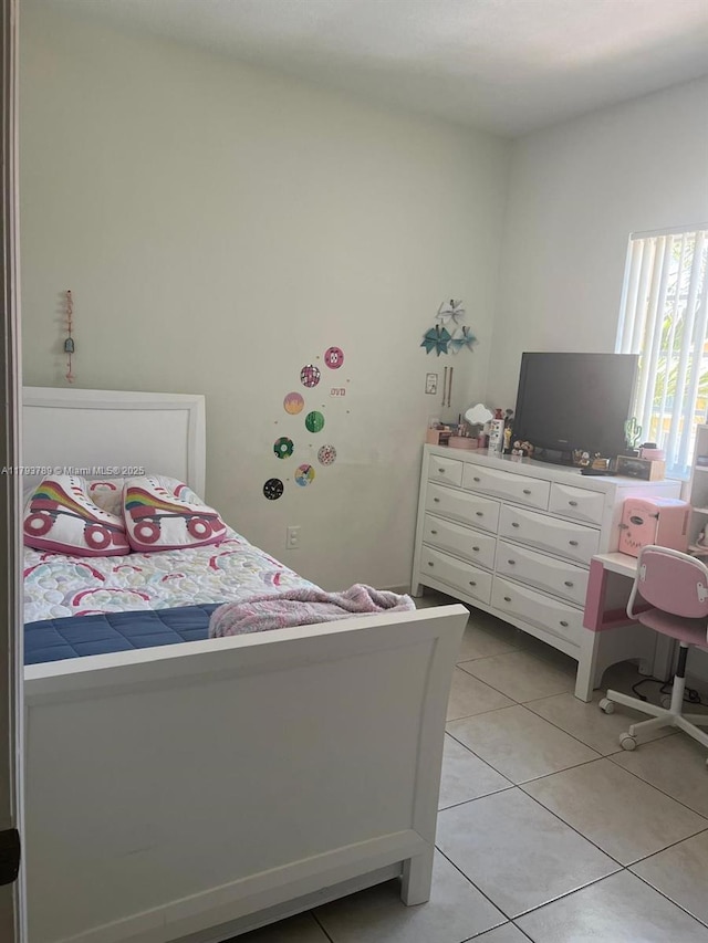 bedroom featuring light tile patterned floors