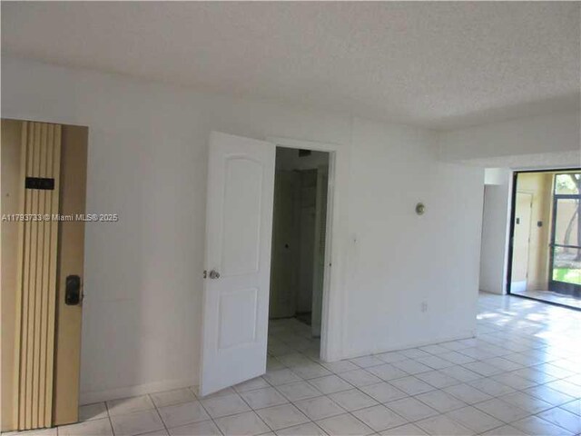 8005 SW 107th Ave Unit 118, Miami, FL 33173 - unfurnished room with light tile patterned flooring
