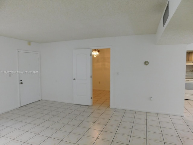 8005 SW 107th Ave Unit 118, Miami, FL 33173 - unfurnished room featuring light tile patterned flooring, a textured ceiling, and visible vents