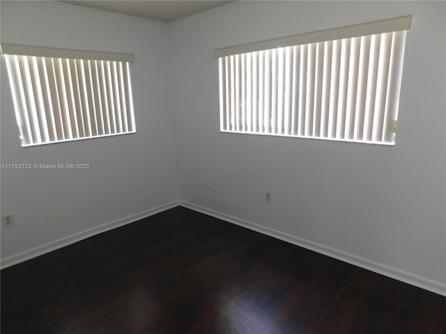 8005 SW 107th Ave Unit 118, Miami, FL 33173 - spare room with baseboards and dark wood-style floors