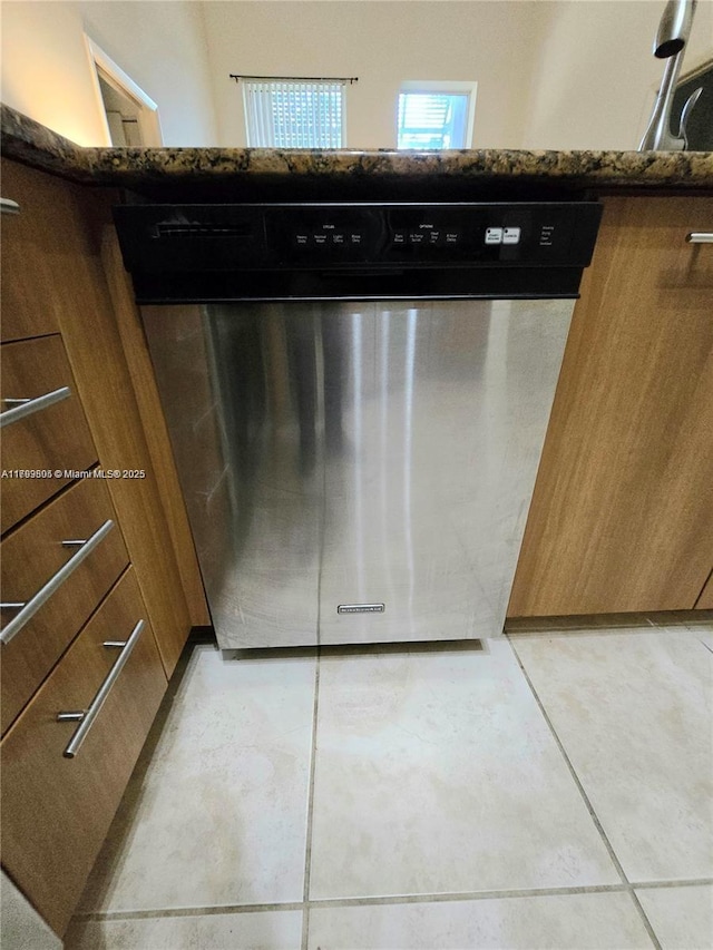 details with stainless steel dishwasher and brown cabinets