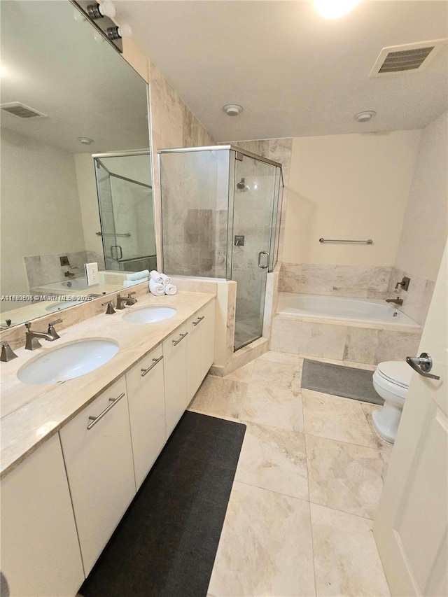 full bath featuring visible vents, a garden tub, double vanity, a sink, and a stall shower