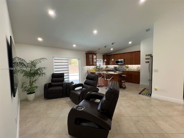 living room featuring light tile patterned floors, baseboards, recessed lighting, and lofted ceiling