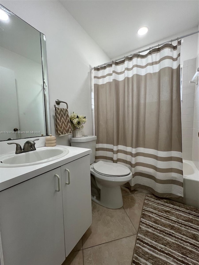 bathroom with tile patterned flooring, vanity, toilet, recessed lighting, and shower / tub combo