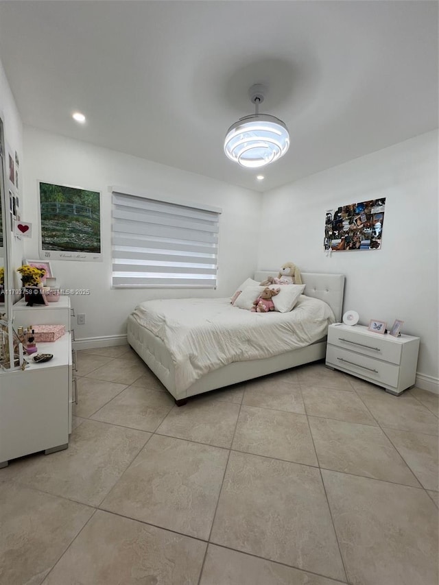 bedroom featuring baseboards, recessed lighting, and light tile patterned floors