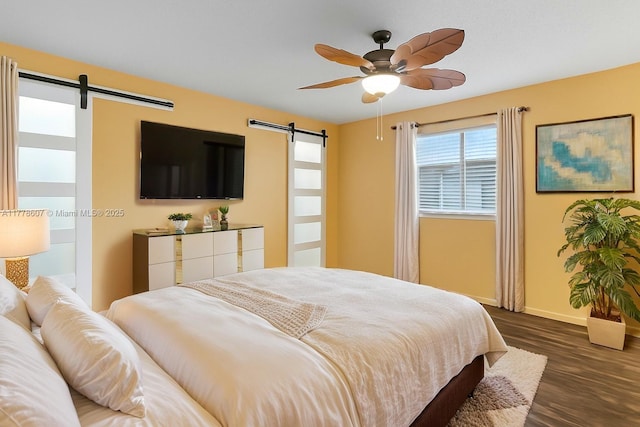 22483 Labrador St, Boca Raton, FL 33428 - bedroom featuring a barn door, dark wood finished floors, and ceiling fan