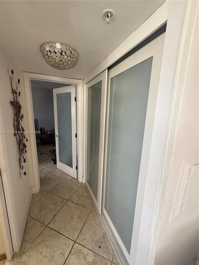 1881 Washington Ave Unit 8C, Miami Beach, FL 33139 - corridor featuring light tile patterned floors