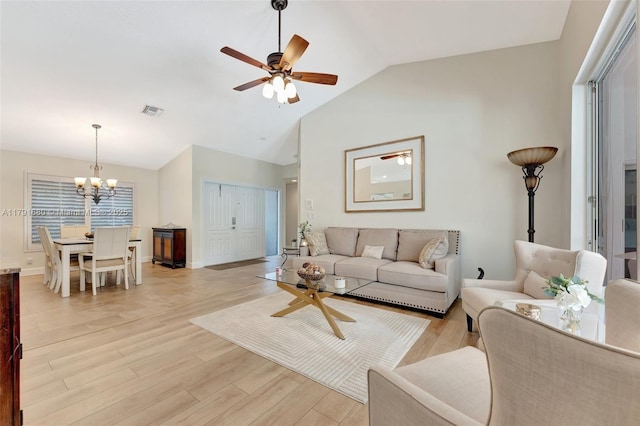 5133 N Springs Way, Coral Springs, FL 33076 - living area with visible vents, light wood finished floors, lofted ceiling, and ceiling fan with notable chandelier