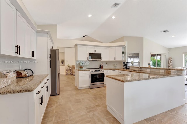 5133 N Springs Way, Coral Springs, FL 33076 - kitchen with visible vents, a sink, vaulted ceiling, and stainless steel appliances
