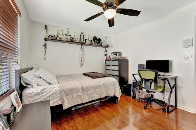 5133 N Springs Way, Coral Springs, FL 33076 - bedroom with baseboards, ceiling fan, and wood finished floors