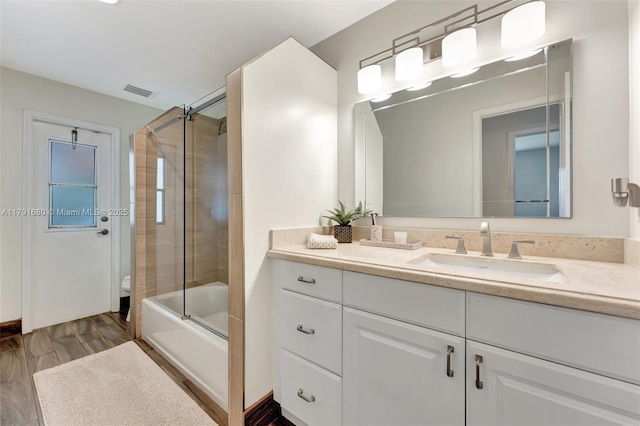 5133 N Springs Way, Coral Springs, FL 33076 - full bath with visible vents, bath / shower combo with glass door, and vanity