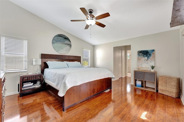 5133 N Springs Way, Coral Springs, FL 33076 - bedroom featuring baseboards, vaulted ceiling, and wood finished floors